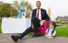 The VERY odd couple: Shortest man ever (21.5ins) meets tallest living person (8ft 1in) outside the Houses of Parliament for Guinness World Record Day