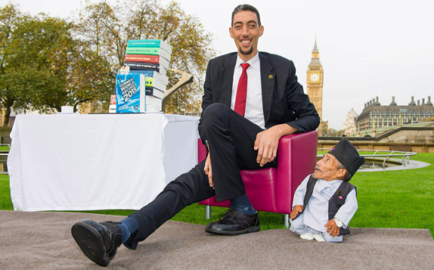 The VERY odd couple: Shortest man ever (21.5ins) meets tallest living person (8ft 1in) outside the Houses of Parliament for Guinness World Record Day