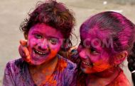 Colours rule streets as people celebrate Holi