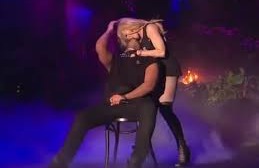 Drake gets kissed by Madonna, screws up his face in apparent discomfort